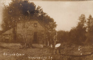 Postcard of old cabin