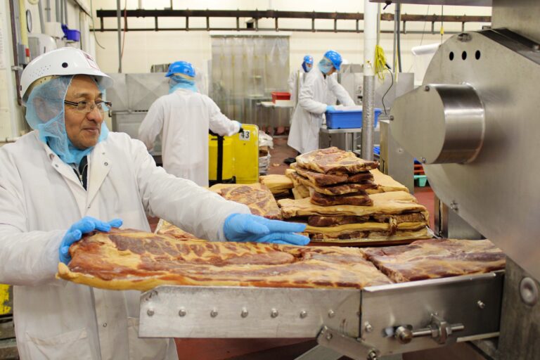 worker in meat processing plant